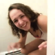 A girl pooping on a toilet is surprised when her friends barge into the bathroom to videotape her!